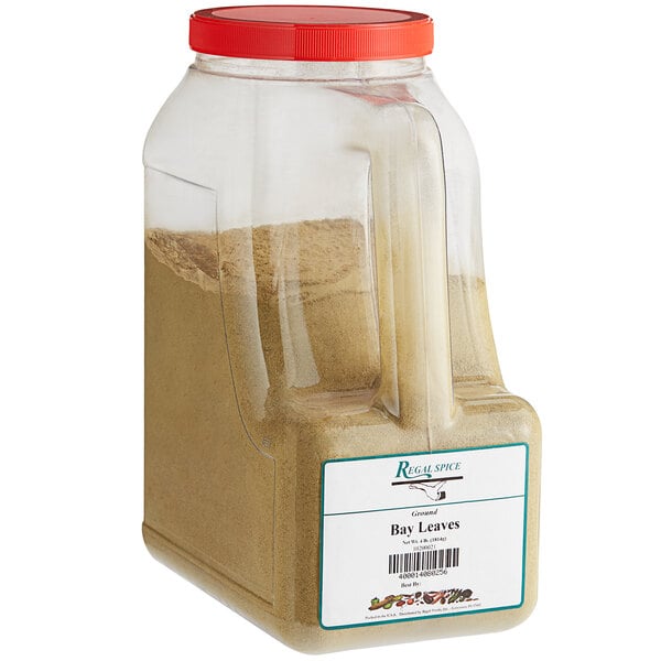 A plastic container of brown ground Regal Bay Leaves.
