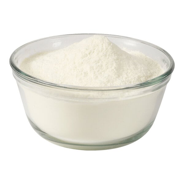 A bowl of malted milk powder on a white background.