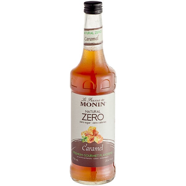 A bottle of Monin Zero Calorie Caramel Flavoring Syrup with a white label.