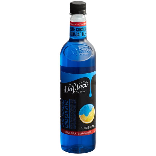 A close up of a DaVinci Gourmet Classic Blue Curacao flavoring syrup bottle with a black cap.