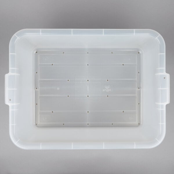 A Vollrath Traex Color-Mate clear plastic container with holes in it.