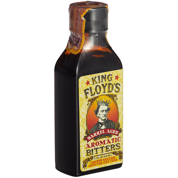 A case of King Floyd's Barrel Aged Aromatic Bitters with a yellow label.