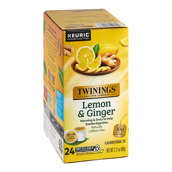 A box of Twinings Lemon & Ginger Herbal Tea K-Cup Pods with lemons and ginger on the box.