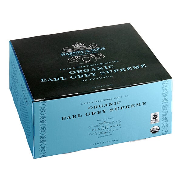 A blue and black box of Harney & Sons Organic Earl Grey Tea on a counter.