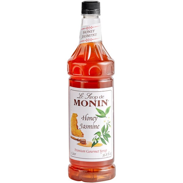 A Monin Honey Jasmine flavoring syrup bottle with a label.