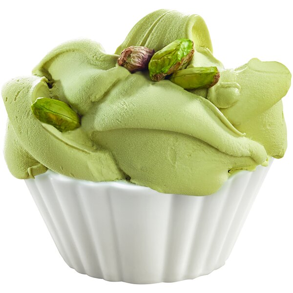 A cup of green Fabbri Fabbrisoff emulsified ice cream with pistachios.