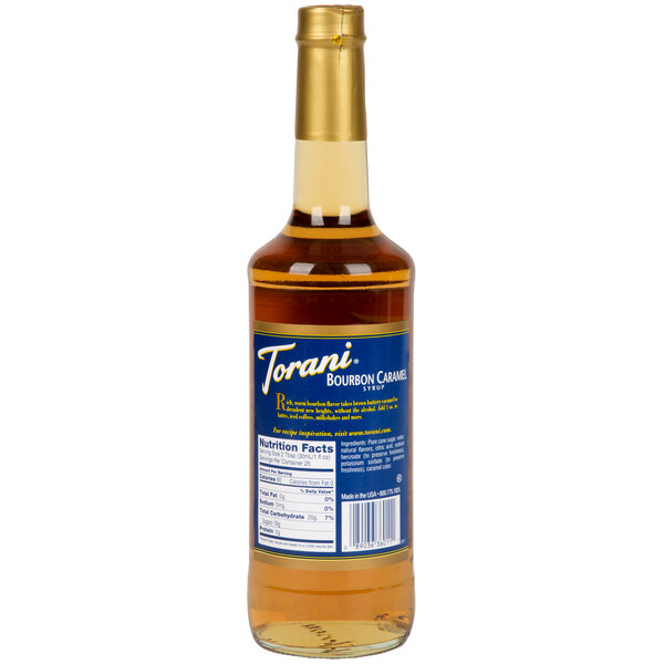 A Torani Bourbon Caramel Flavoring Syrup bottle with a blue label.
