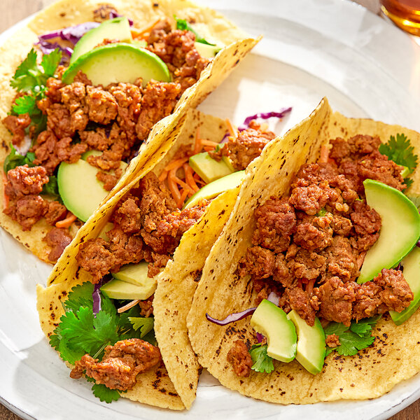 A plate of tacos with Regal Mexican Chorizo sausage, meat, and vegetables.
