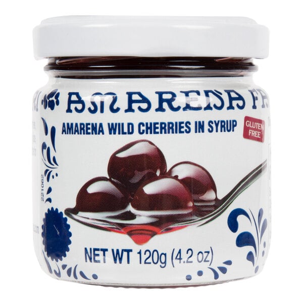 A jar of Fabbri Amarena Cherries in syrup with a white lid.