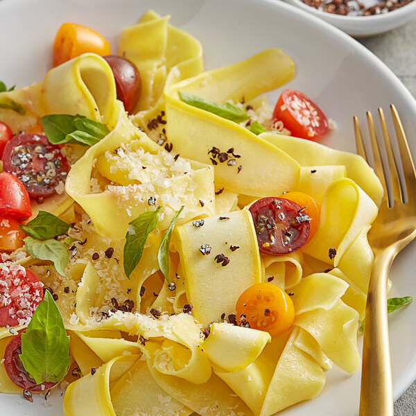 A close up of a bowl of food with yellow specks.