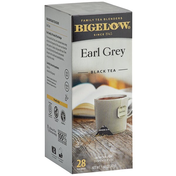 A box of Bigelow Earl Grey Tea on a table with a cup of tea.