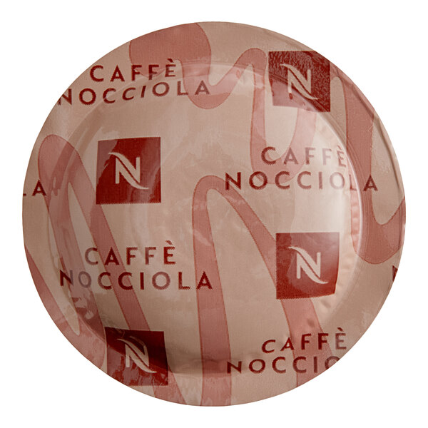 A Nespresso Caffe Nocciola coffee capsule on a plate.