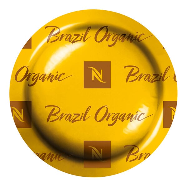A yellow sign with brown text reading "Nespresso Professional Brazil Organic"