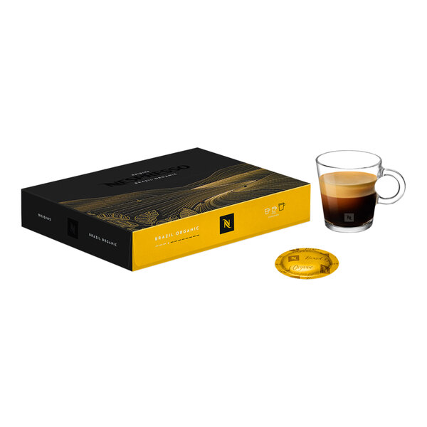A black and yellow box of Nespresso Professional Brazil Organic coffee capsules with a cup of coffee and a saucer.