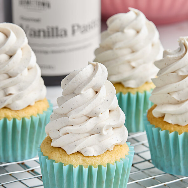 A group of cupcakes with Hometown Provisions Vanilla Bean Paste frosting on top.