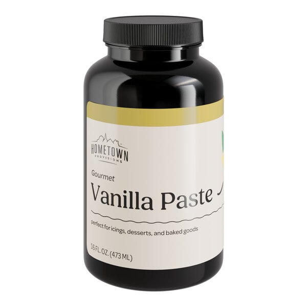 A black bottle of Hometown Provisions Vanilla Bean Paste with a white label.