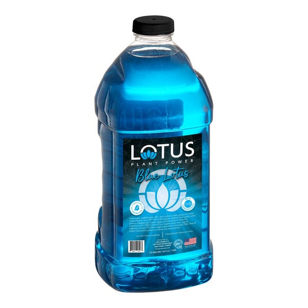 A large clear plastic bottle filled with bright blue liquid and labeled 'Lotus Plant Power Blue Lotus' with a black cap.