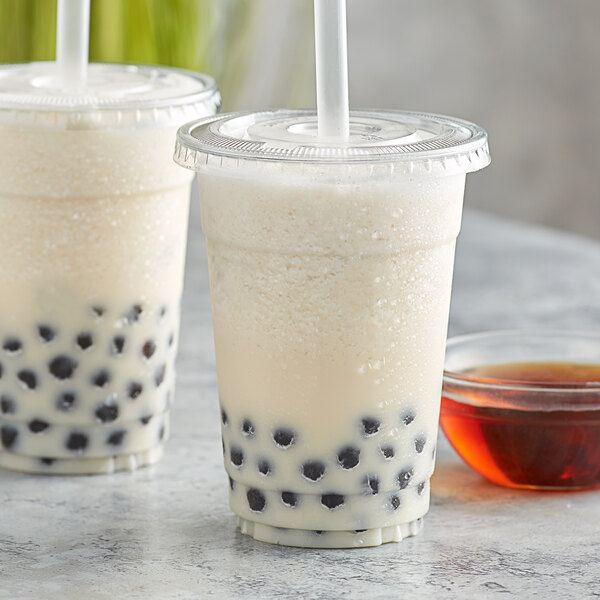 Two cups of bubble tea with Bossen caramel syrup and black balls.