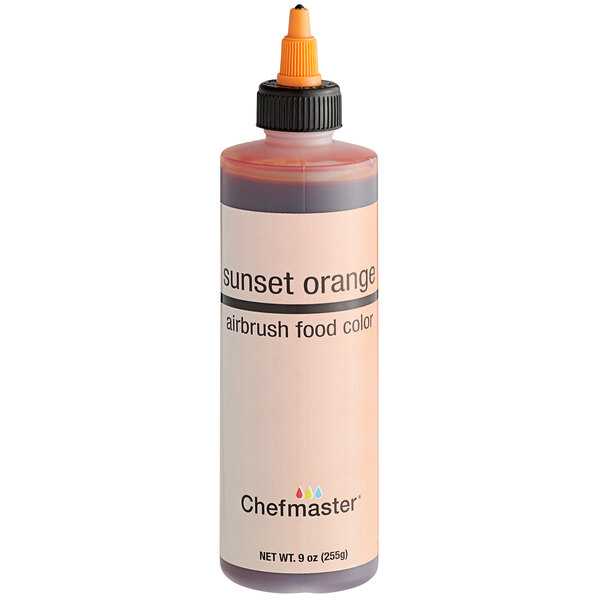 A Chefmaster Sunset Orange food coloring bottle.