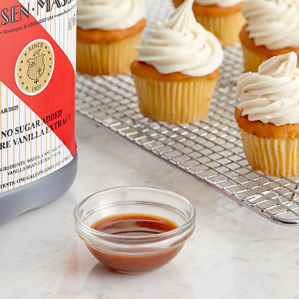 A close-up of a cupcake with white frosting.