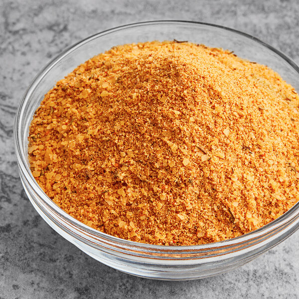 A bowl of yellow J.O. No. 2 Crab Seasoning powder.