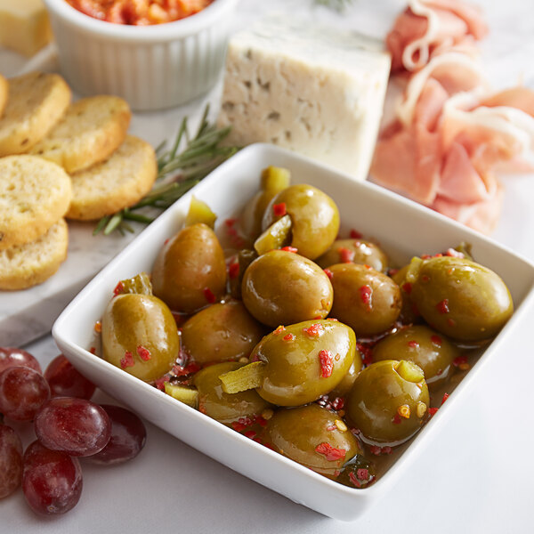 A bowl of Belosa green olives stuffed with sweet and spicy pickles.