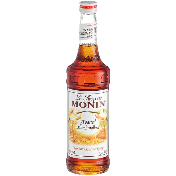 A bottle of Monin Toasted Marshmallow syrup with a white label.