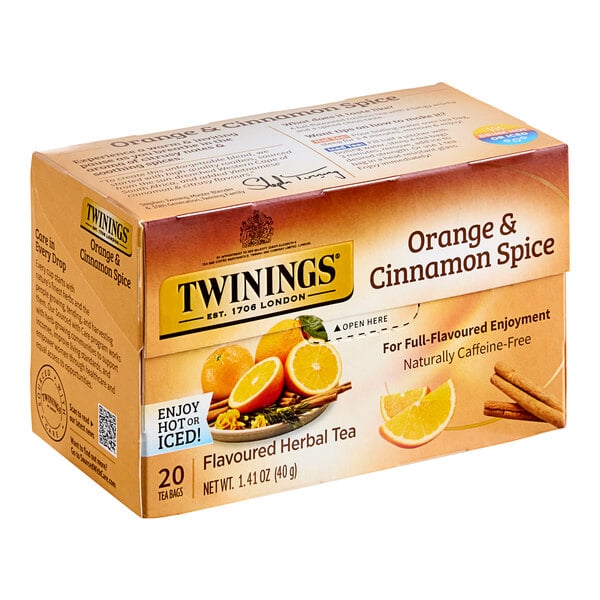 A box of Twinings Orange & Cinnamon Spice Herbal Tea Bags with oranges and cinnamon on the box.