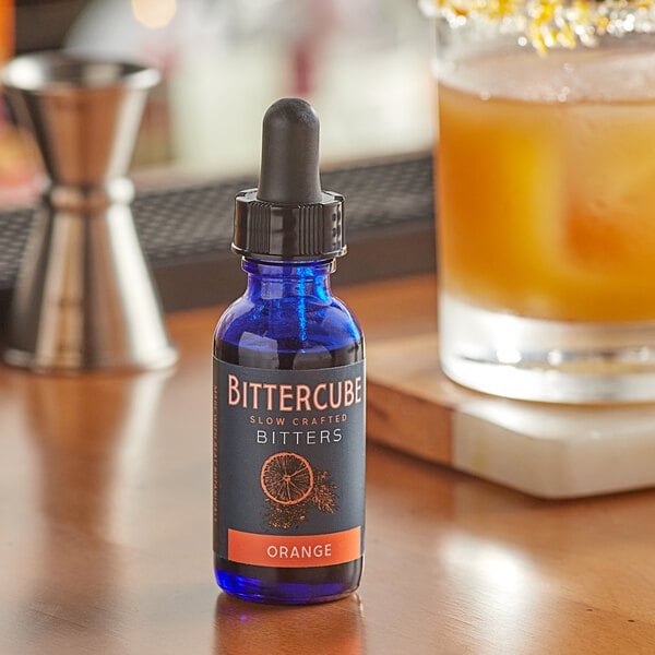 A case of Bittercube Orange Bitters bottles on a table.