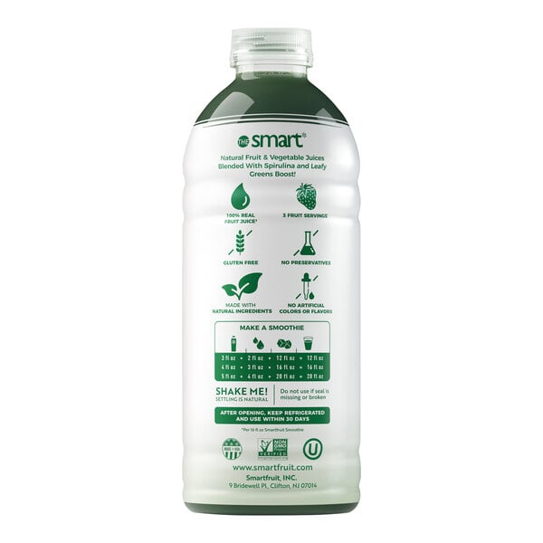 A white bottle of Smartfruit Harvest Greens puree with green labels containing green liquid.