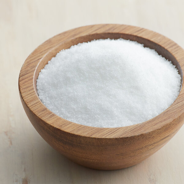 A bowl of Splenda Monk Fruit sweetener on a table.