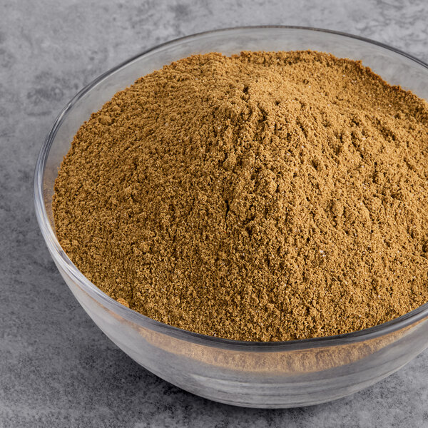 A bowl of brown Regal Big Flavor BBQ Rub seasoning powder.