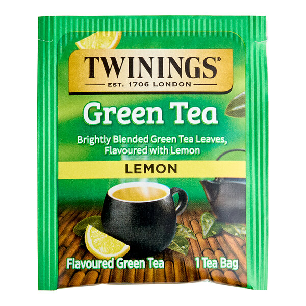 A green Twinings tea packet with "Green Tea with Lemon" on it.