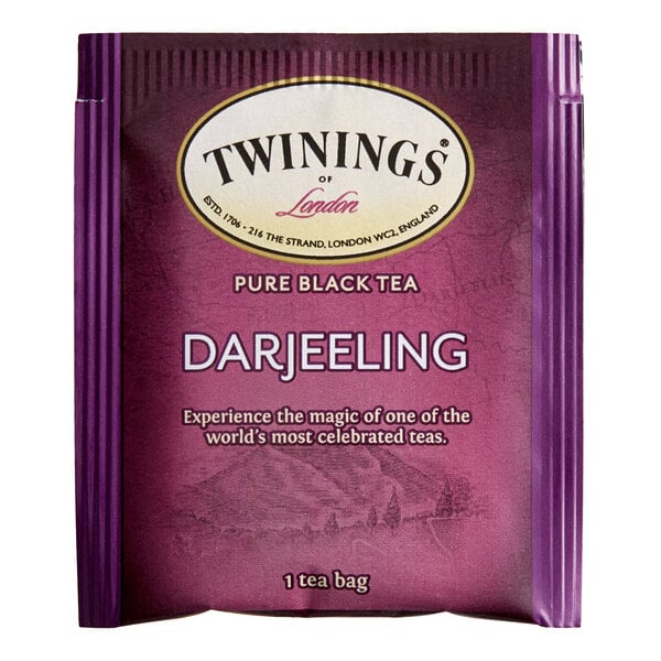 A purple and white package of Twinings Darjeeling Tea Bags.