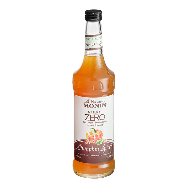 A case of 6 Monin Zero Calorie Natural Pumpkin Spice Flavoring Syrup bottles with orange liquid and white labels.