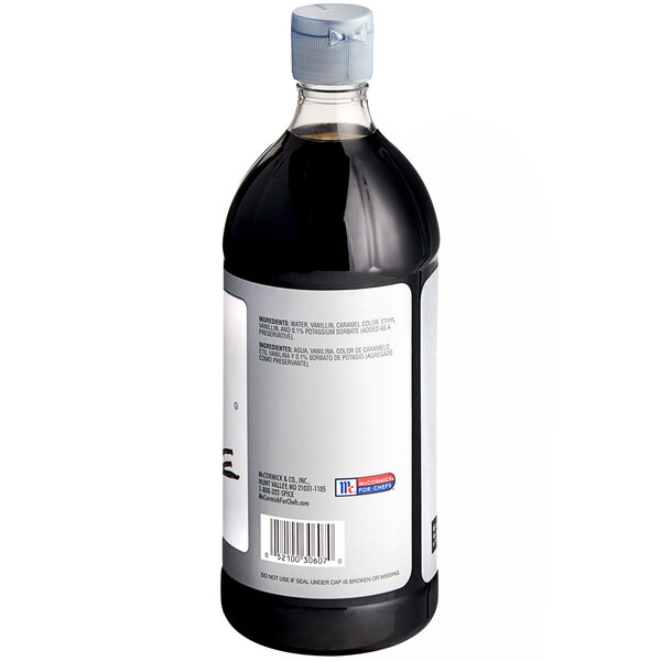 A close-up of a McCormick Culinary Imitation Vanilla liquid bottle with a white label.