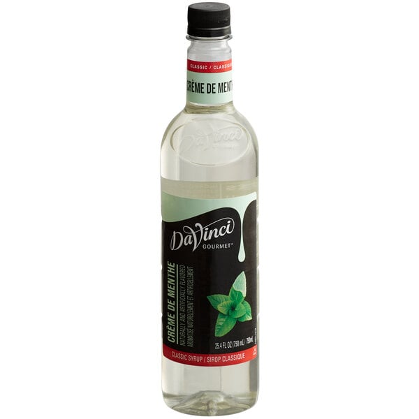 A close up of a bottle of DaVinci Gourmet Classic Creme de Menthe Flavoring Syrup with a black cap.