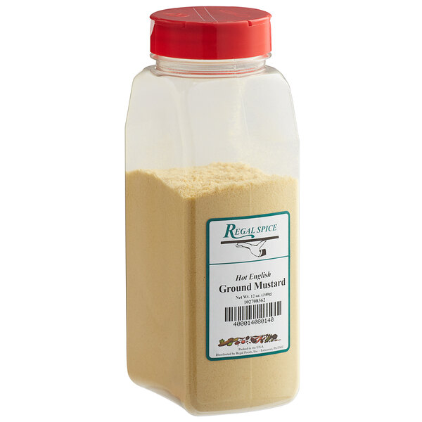 A plastic container with a red lid of Regal Ground Hot English Mustard Seed.