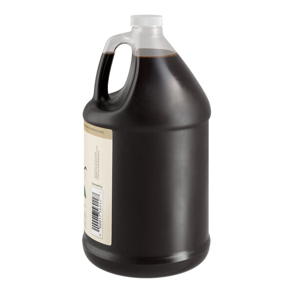 A jug of brown liquid with a white label.