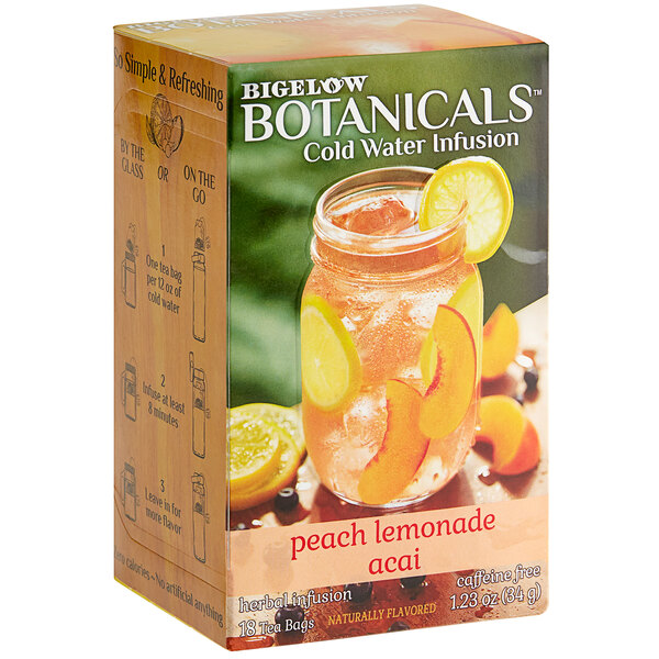 A box of Bigelow Botanicals Peach Lemonade Acai Cold Water Infusion Tea Bags on a counter.