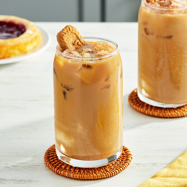 Two glasses of iced coffee with Fanale Tiger Style Brown Sugar syrup and cookies on top.