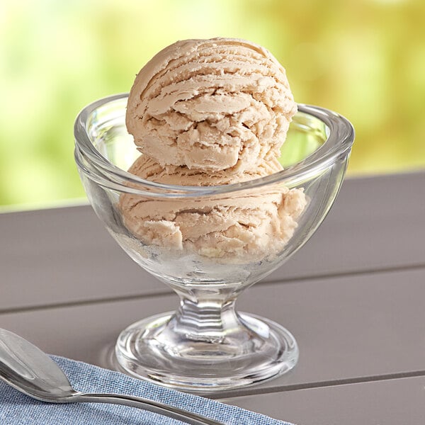 A close-up of a bowl of Oringer Bavarian hard serve ice cream with a spoon.