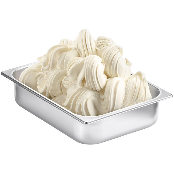 A metal container with white swirls of Fabbri New York Cheesecake flavoring powder.