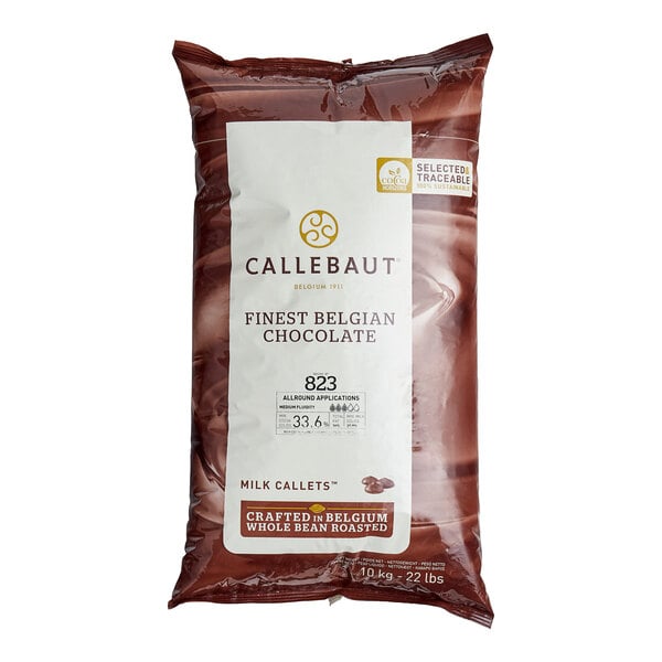 A bag of Callebaut milk chocolate callets on a white background.