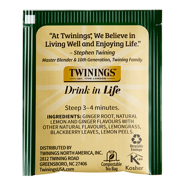 A green Twinings package of Lemon & Ginger Herbal Tea Bags with white and black text.