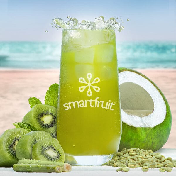 A glass of green Smartfruit Restore beverage with kiwi fruit garnish.