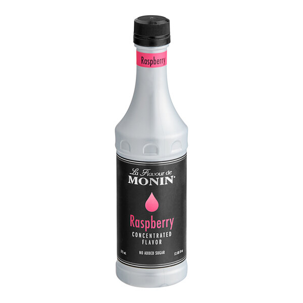 A white Monin bottle with a black label.