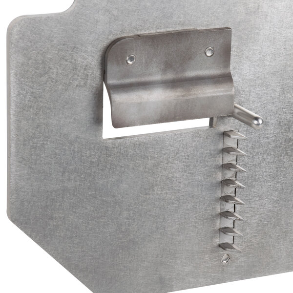 A Nemco Spiral Fry Face Plate with a metal surface and a hole in the middle.