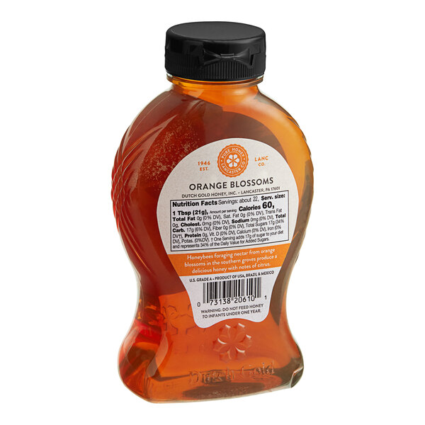 A case of 6 bottles of Dutch Gold Orange Blossom Honey with a label.