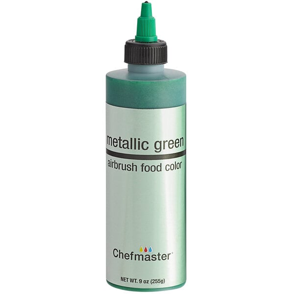 A close-up of a Chefmaster Metallic Green food coloring bottle with a black cap.